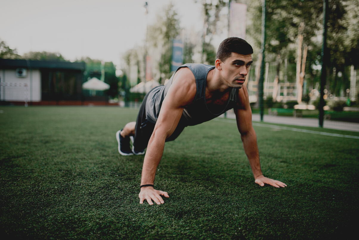 Athlete Doing Push-up Exercise on Outdoor Workout